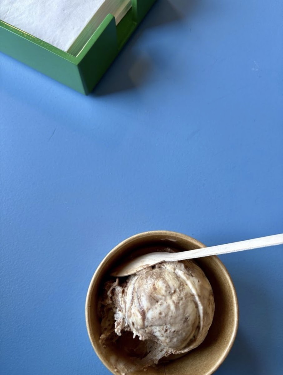 Scoop of ice cream on blue counter